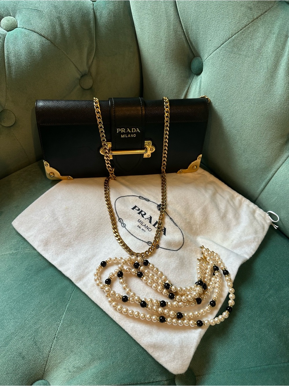 Prada Cahier Black Saffiano clutch bag.